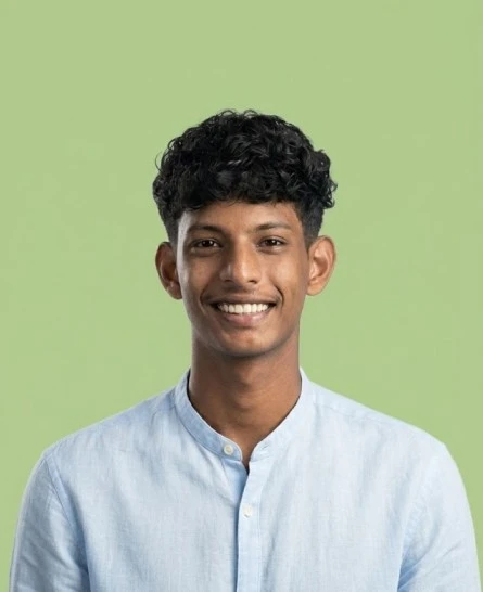 Portrait of a freelance digital marketer in Kerala against a green background